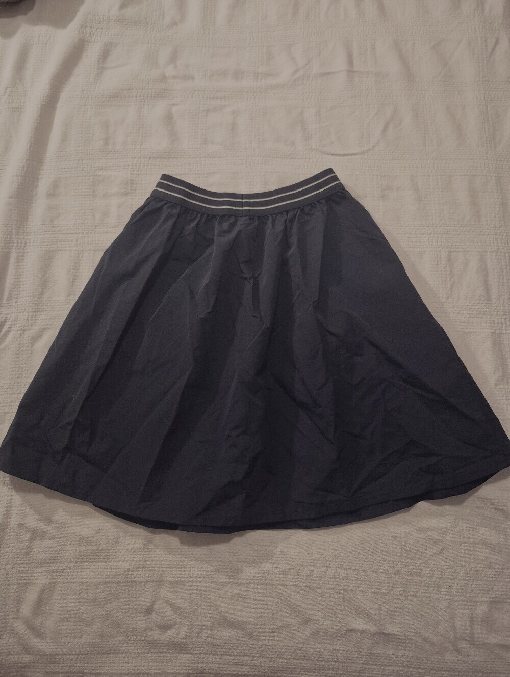 Uniqlo girls size 9-10 navy blue Tuck skirt front pockets, elastic waist NWT